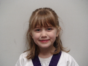 United Tang Soo Do Alliance Karate Manchester - Li' Dragon of the Quarter - Emma is 5 years old and joined us as a Lil’ Dragon in the beginning of January earlier this year.  Currently an Orange Belt, she lives with her mom, dad and big sister Abigail in Manchester.   Emma is very excited to begin Kindergarten at Orendorff Elementary this upcoming September!  Emma loves Chinese food; with her all-time favorite food being rice.  Her favorite activities in karate include playing Poofball and working on her kicks.  When Emma is not practicing martial arts, she enjoys swimming at Pine Ridge Swim Club and playing Pet Shops.